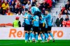 Leverkusen players celebrate their side's first goal of the game during the Bundesliga soccer match between Bayer Leverkusen and SC Freiburg at the Europa-Park Stadium in Freiburg im Breisgau, Germany, Sunday March 17, 2024. (Tom Weller/dpa via AP)