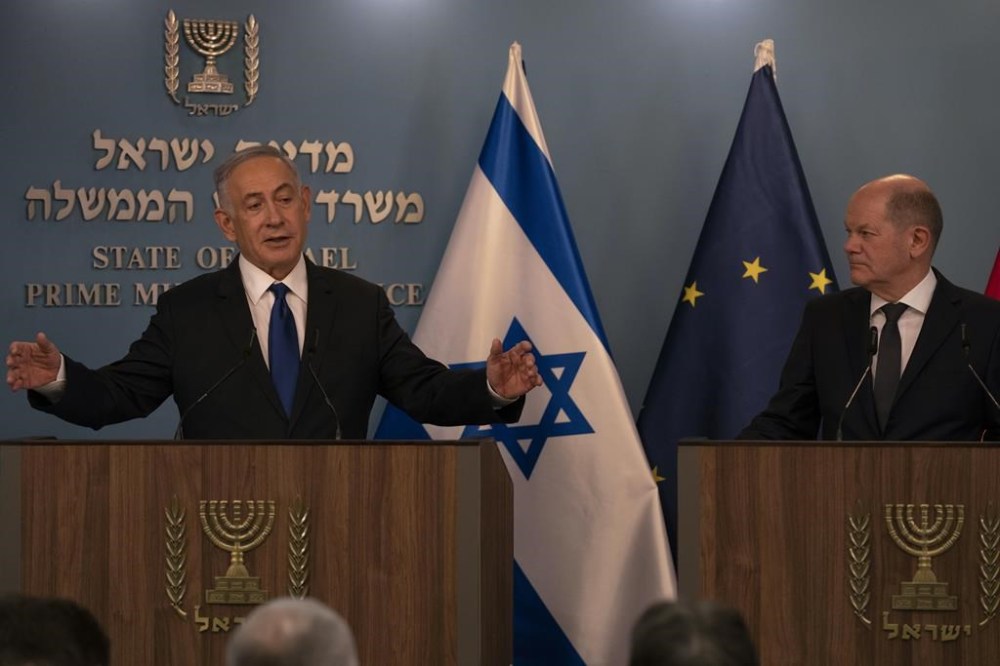 Israeli Prime Minister Benjamin Netanyahu, left, delivers his speech after a meeting with German Chancellor Olaf Scholz in Jerusalem, Israel, Sunday, March 17, 2024. (AP Photo/Leo Correa, Pool)
