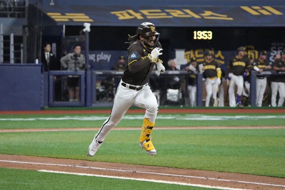 San Diego Padres' center fielder Fernando Tatis Jr. Runs to the first base during the exhibition game between the Team Korea and San Diego Padres at the Gocheok Sky Dome in Seoul, South Korea, Sunday, March 17, 2024. The Los Angeles Dodgers and the San Diego Padres will meet in a two-game series on March 20th-21st in Seoul for the MLB World Tour Seoul Series. (AP Photo/Ahn Young-Joon)