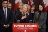 Ontario Liberal Leader Bonnie Crombie says if she is premier after the 2026 election, she will not introduce a provincial carbon tax. Crombie stands with Ontario Liberal caucus members as she talks to the media at the Queens Park Legislature in Toronto on Tuesday, December 5, 2023. THE CANADIAN PRESS/Chris Young