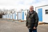 Jim Gunn, a board member of Beacon House Shelter, stands in front of the Pallet house camp in Lower Sackville, N.S., on Wednesday, Mar. 13, 2024. THE CANADIAN PRESS/Kelly Clark