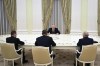 Russian President Vladimir Putin attends a meeting with candidates who ran in the Russian presidential elections, Nikolai Kharitonov, right, Leonid Slutsky, 2nd left, and Vladislav Davankov, left, in Moscow, Russia, Monday, March 18, 2024. (Grigory Sysoyev, Sputnik, Kremlin Pool Photo via AP)