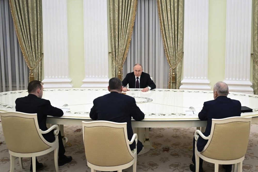 Russian President Vladimir Putin attends a meeting with candidates who ran in the Russian presidential elections, Nikolai Kharitonov, right, Leonid Slutsky, 2nd left, and Vladislav Davankov, left, in Moscow, Russia, Monday, March 18, 2024. (Grigory Sysoyev, Sputnik, Kremlin Pool Photo via AP)