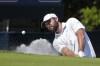 Scottie Scheffler hits out of the sand on the second green during the final round of The Players Championship golf tournament Sunday, March 17, 2024, in Ponte Vedra Beach, Fla. (AP Photo/Marta Lavandier)