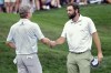 Scottie Scheffler, right, shakes hands with Nate Lashley after completing their round during the final round of The Players Championship golf tournament Sunday, March 17, 2024, in Ponte Vedra Beach, Fla. (AP Photo/Marta Lavandier)