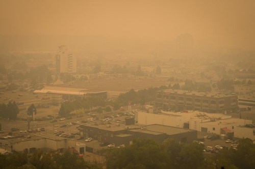 Smoke from wildfires fills the air in Kelowna, B.C., Saturday, Aug. 19, 2023.&nbsp;Canada's air quality last year was worse than the United States for the first time since a firm started publishing its annual assessment in 2018.The 2023 World Air Quality report from Swiss company IQAir says raging wildfires were a major contributor to the drop in Canada's air quality. THE CANADIAN PRESS/Darryl Dyck