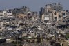 Destroyed buildings stand inside Gaza Strip, as seen from southern Israel, Tuesday, March 19, 2024. (AP Photo/Ariel Schalit)