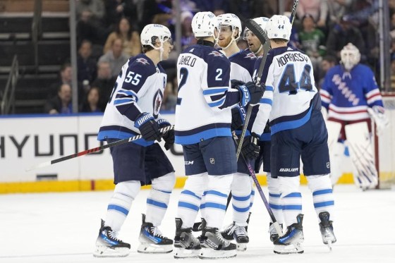 Winnipeg Jets centre Mark Scheifele (55) celebrates with his teammates after scoring against the New York Rangers on Tuesday. (Mary Altaffer / The Associated Press files)