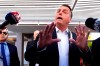FILE - Former Brazilian President Jair Bolsonaro speaks to the press outside his home after Federal Police agents carried out a search and seizure warrant in Brasilia, Brazil, May 3, 2023. When asked about the search of Bolsonaro's home in Brasilia, the Federal Police press office gave a statement saying officers were carrying out searches and arrests related to the introduction of fraudulent data related to the COVID-19 vaccine into the nation's health system. (AP Photo/Eraldo Peres)
