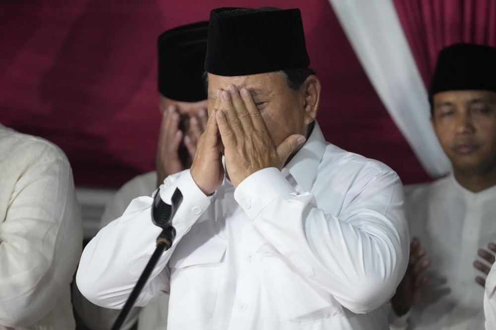 Indonesia's Defense Minister Prabowo Subianto prays after winning the Feb. 14 election in Jakarta, Indonesia, Wednesday, March 20, 2024. Subianto was announced the winner of last month's presidential election Wednesday over two former governors who have vowed to contest the result in court over alleged irregularities. (AP Photo/Achmad Ibrahim)