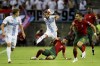 FILE - Portugal's Bruno Fernandes, on the ground, tries to tackle Luxembourg's Danel Sinani during the Euro 2024 group J qualifying soccer match between Portugal and Luxembourg at the Algarve stadium outside Faro, Portugal, on Sept. 11, 2023. To soccer fans of a certain age, the idea of Luxembourg getting this close to qualifying for a European Championship is just incredible. Win two playoff games in five days, at Georgia on Thursday then hosting either Greece or Kazakhstan on Tuesday, and Luxembourg will be the unlikely Cinderella story at Euro 2024 in June. (AP Photo/Joao Matos, File)