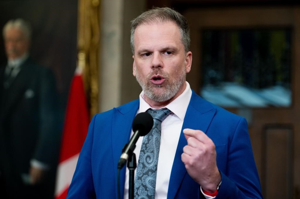 Mark Holland, Minister of Health, speaks to reporters in the Foyer of the House of Commons on Parliament Hill in Ottawa, on Wednesday, March 20, 2024. THE CANADIAN PRESS/Spencer Colby