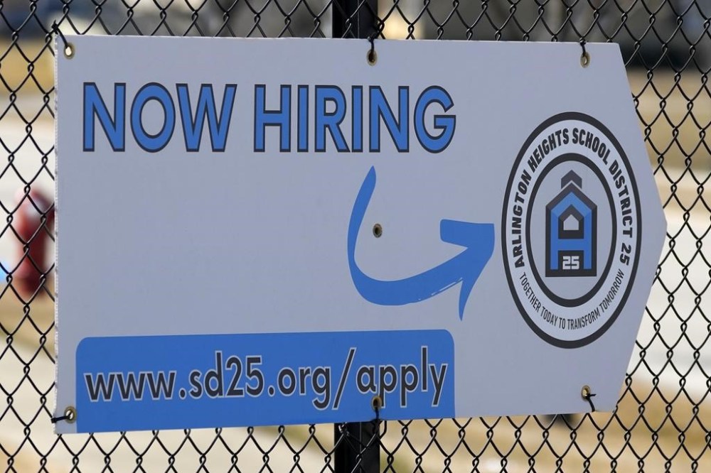 A hiring sign is displayed in Arlington Heights, Ill., Monday, Feb. 26, 2024. On Thursday, March 21, 2024, Freddie Mac reports on this week's average U.S. mortgage rates. (AP Photo/Nam Y. Huh)