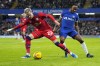 Preston's Liam Millar, left, and Chelsea's Raheem Sterling vie for the ball during the English FA Cup soccer match between Chelsea and Preston North End at Stamford Bridge stadium in London, Saturday, Jan. 6, 2024. On loan from Switzerland's FC Basel to Preston North End near where he grew up, Canadian forward Millar has enjoyed being closer to family and friends in England. THE CANADIAN PRESS/AP/Kirsty Wigglesworth