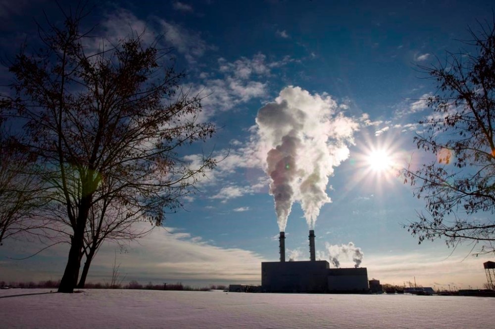 Canada's carbon price could slash greenhouse gas emissions by more than 100 million tonnes a year by 2030 but only about one-fifth of that will come from the consumer carbon price at the centre of Conservative attacks. Smoke rises from the stacks at an energy facility in Toronto on Thursday January 15, 2009. THE CANADIAN PRESS/Frank Gunn