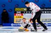 Canada's Jocelyn Peterman and Brett Gallant, right, in action during the Round Robin game between England and Canada at the World Mixed Doubles Curling Championship 2022, at the Sous-Moulin Sports Centre, in Geneva, Switzerland, Wednesday, April 27, 2022. THE CANADIAN PRESS/Martial Trezzini/Keystone via AP