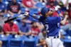 Toronto Blue Jays designated hitter Justin Turner (2) watches a fly ball in the first inning of a spring training baseball game against the Philadelphia Phillies Monday, March 4, 2024, in Dunedin, Fla. Justin Turner and Kevin Kiermaier both homered in the first inning as the Toronto Blue Jays held on to an early lead to defeat the Pittsburgh Pirates 3-2 in pre-season action on Thursday. THE CANADIAN PRESS/AP, Charlie Neibergall