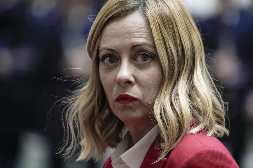 FILE - Italian Premier Giorgia Meloni arrives in the courtyard of the Italian government office Chigi Palace, to meet Kazakhstan President Kassym-Jomart Tokayev, in Rome, Thursday, Jan. 18, 2024. Meloni has been asked to testify in court July 2, 2024 in the trial of two men who are accused of making deepfake pornographic images using her face and posting them online. Meloni is listed as an injured party in the defamation trial in Sardinia. (AP Photo/Andrew Medichini, File)