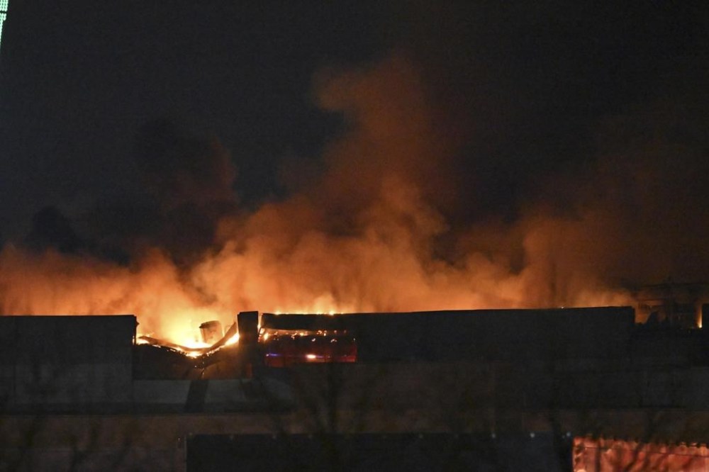 A massive blaze is seen over the Crocus City Hall on the western edge of Moscow, Russia, Friday, March 22, 2024. Several gunmen have burst into a big concert hall in Moscow and fired automatic weapons at the crowd, injuring an unspecified number of people and setting a massive blaze in an apparent terror attack days after President Vladimir Putin cemented his grip on the country in a highly orchestrated electoral landslide. (AP Photo/Dmitry Serebryakov)