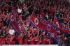 North Korea's fans cheer for their team during the FIFA World Cup 2026 and AFC Asian Cup 2027 preliminary joint qualification round 2 match between Japan and North Korea at the National Stadium Thursday, March 21, 2024, in Tokyo. (AP Photo/Eugene Hoshiko)