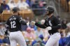 Chicago White Sox's Paul DeJong, right, celebrates after his two-run home run against the Chicago Cubs with teammate evin Pillar (12) during the second inning of a spring training baseball game Friday, March 15, 2024, in Phoenix. (AP Photo/Ross D. Franklin)