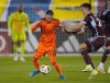 Houston Dynamo midfielder Sebastian Kowalczyk, left, fights for control of the ball with Colorado Rapids midfielder Cole Bassett in the first half of an MLS soccer match Saturday, March 23, 2024, in Commerce City, Colo. (AP Photo/David Zalubowski)