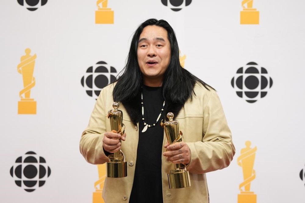 Aysanabee poses with the Juno Awards for Songwriter of the Year and Alternative Album of the Year during the Juno Awards in Halifax on Saturday, March 23, 2024. THE CANADIAN PRESS/Darren Calabrese