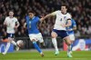 England's Harry Maguire challenges for the ball with Brazils' Raphinha during an international friendly soccer match between England and Brazil, at the Wembley Stadium in London, Saturday, March 23, 2024. (AP Photo/Kirsty Wigglesworth)