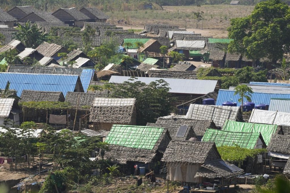A camp for internally displaced people in Myanmar is seen across the Moei river from Mae Sot, Tak province Thailand Monday, March 25, 2024. Thailand delivered its first batch of humanitarian aid to war-torn Myanmar sending ten trucks over the border from the northern province of Tak in what they hope will be a continuing effort to ease the plight of millions of people displaced by fighting. (AP Photo/Sakchai Lalit)