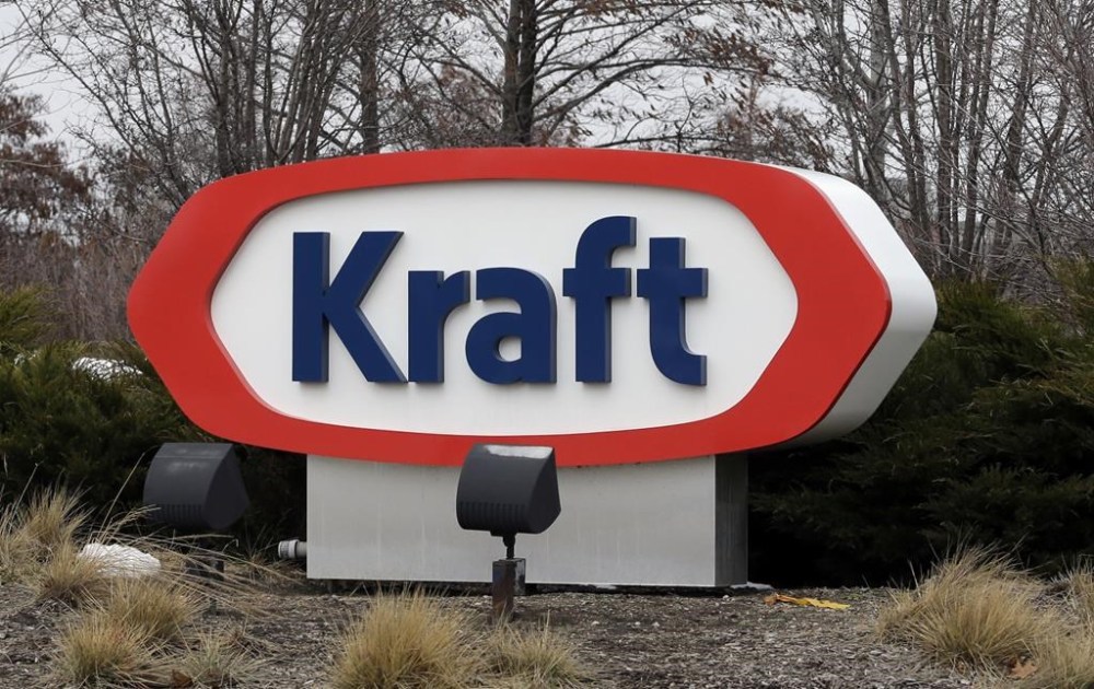 FILE - This March 25, 2015, file photo shows the Kraft logo in Northfield, Ill. The Biden administration announced $6 billion in funding Monday, March 25, 2024, for projects that will slash emissions from the industrial sector — the largest-ever U.S. investment to decarbonize domestic industry to fight climate change. Kraft Heinz will install heat pumps, electric heaters and electric boilers to decarbonize food production at numerous facilities. (AP Photo/Nam Y. Huh, File)