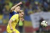 Bosnia's Amar Dedic, background, and Ukraine's Mykhailo Mudryk challenge for the ball during the Euro 2024 playoff soccer match between Bosnia and Ukraine in Zenica, Bosnia, Thursday, March 21, 2024. (AP Photo/Armin Durgut)