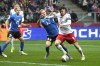 Poland's Robert Lewandowski, right, and Estonia's Ragnar Klavan fight for the ball during the Euro 2024 play off soccer match between Poland and Estonia at the National stadium in Warsaw, Poland, Thursday, March 21, 2024. (AP Photo/Czarek Sokolowski)