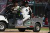 New York Yankees' Oscar Gonzalez leaves the field on a cart after being injured at second inning during an exhibition baseball game at Alfredo Harp Helu Stadium in Mexico City, Monday, March 25, 2024. (AP Photo/Fernando Llano)