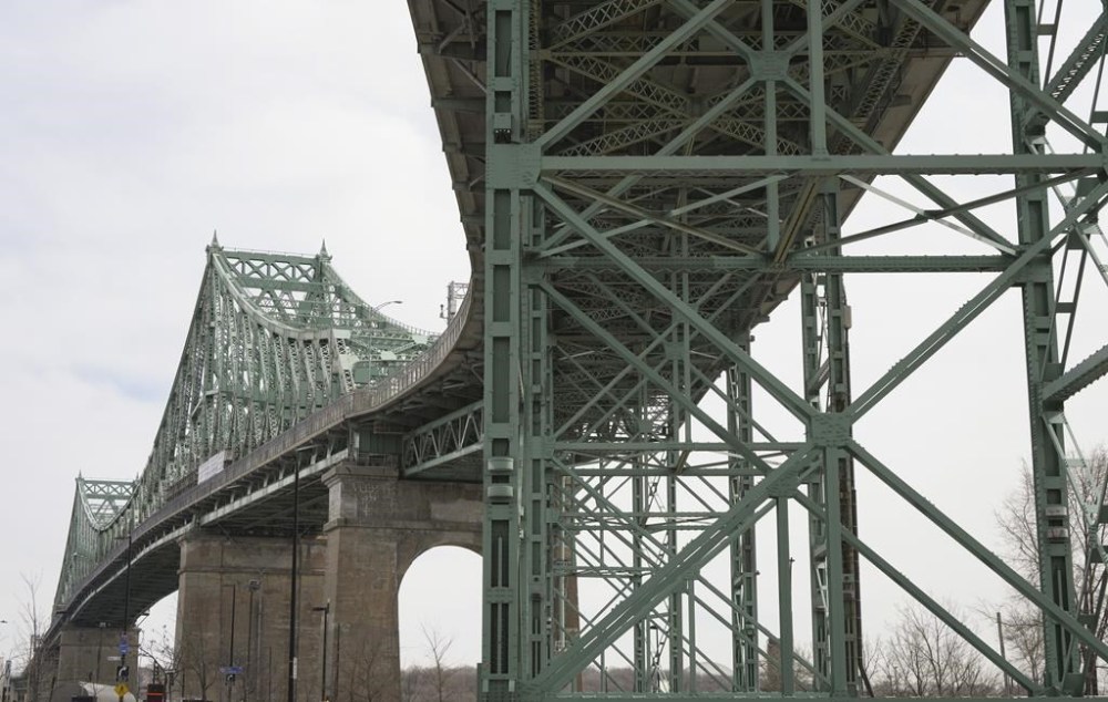 The Jacques Cartier Bridge is seen in Montreal on Tuesday, March 26, 2024. The St. Lawrence Seaway Management Corporation, which runs the shipping route connecting Montreal with Lake Erie, says it monitors traffic along the route 24 hours a day and that steps have been taken to ensure physical infrastructure is secure. THE CANADIAN PRESS/Christinne Muschi