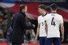 England coach Gareth Southgate speaks to England's John Stones during a friendly soccer match between England and Brazil at Wembley Stadium in London, Saturday, March 23, 2024. (AP Photo/Alastair Grant)
