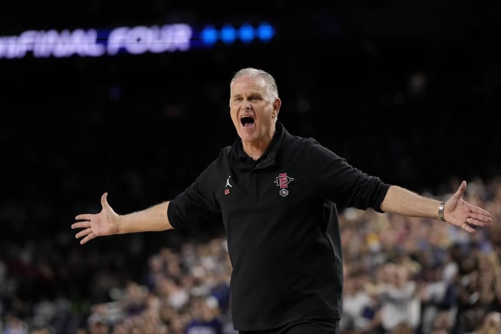 FILE - San Diego State coach Brian Dutcher reacts during the second half of the team's men's national championship college basketball game against UConn in the NCAA Tournament on April 3, 2023, in Houston. UConn pretty much wrecked every team it faced in the turnament on the way to last year's championship and the first two games this March Madness look awfully familiar. Up next is a wrinkle: A rematch with a San Diego State team that was outclassed in the title game a year ago and remembers it. (AP Photo/David J. Phillip, File)