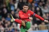 FILE - Portugal's Cristiano Ronaldo attempts a shot at goal during the international friendly soccer match between Slovenia and Portugal at the Stozice stadium in Ljubljana, Slovenia, Tuesday, March 26, 2024. The 24-team lineup is complete and all roads now lead to Germany for the European Championship. (AP Photo/Darko Bandic), File)
