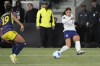 United States forward Sophia Smith, right, crosses the ball past Colombia defender Jorelyn Carabali during the second half of a CONCACAF Gold Cup women's soccer tournament quarterfinal, Sunday, March 3, 2024, in Los Angeles. (AP Photo/Marcio Jose Sanchez)