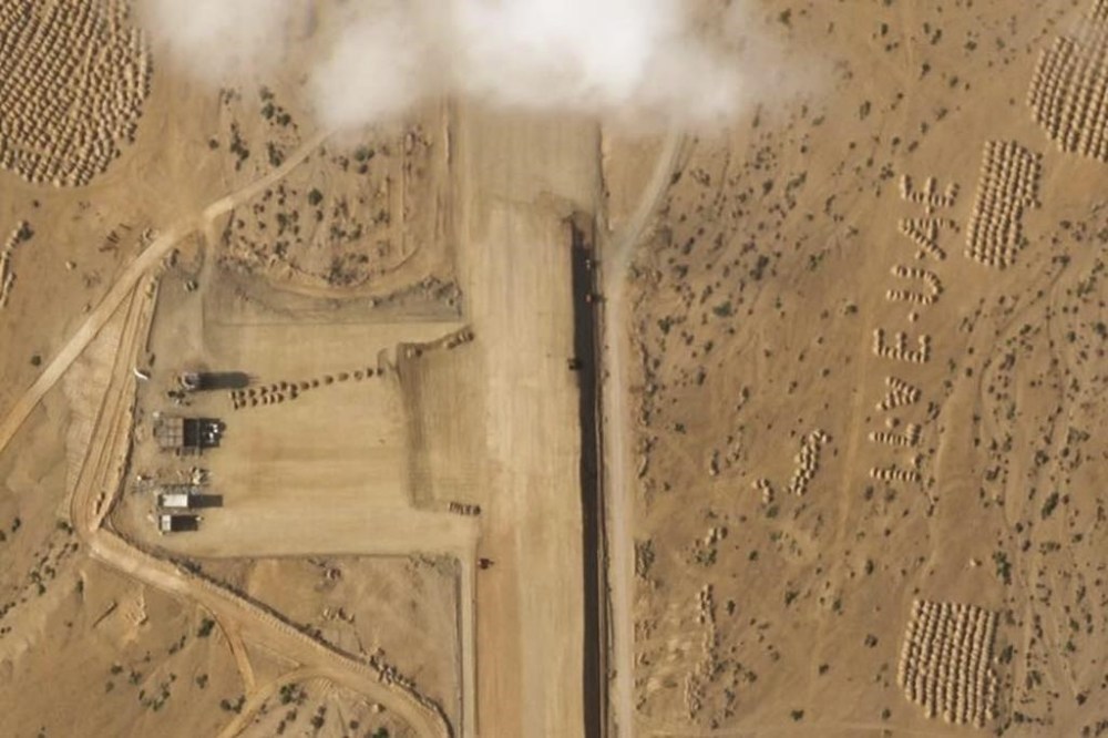 This satellite photo captured by Planet Labs PBC shows the construction of an airstrip on Abd al-Kuri Island, Yemen, Tuesday, March 26, 2024. As Yemen's Houthi rebels continue to target ships in a vital Mideast waterway, satellite pictures analyzed by The Associated Press show what appears to be a new airstrip being built at an entrance to that crucial maritime route. No country has claimed publicly the active construction taking place this month on Abd al-Kuri Island, a barren stretch of land rising out of the Indian Ocean near the mouth of the Gulf of Aden. However, satellite images shot for the AP appear to show workers have laid out
