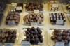 Luxury handmade Belgian Chocolates are seen displayed at Sandrine a chocolate shop owned by Niaz Mardan, in south west London, Thursday, March 21, 2024. Niaz Mardan, is suffering due to high cocoa prices, she's making no profits and fears she will have to close the shop that's been around for 25 years (she's the third owner and took over in 2019). (AP Photo/Kirsty Wigglesworth)