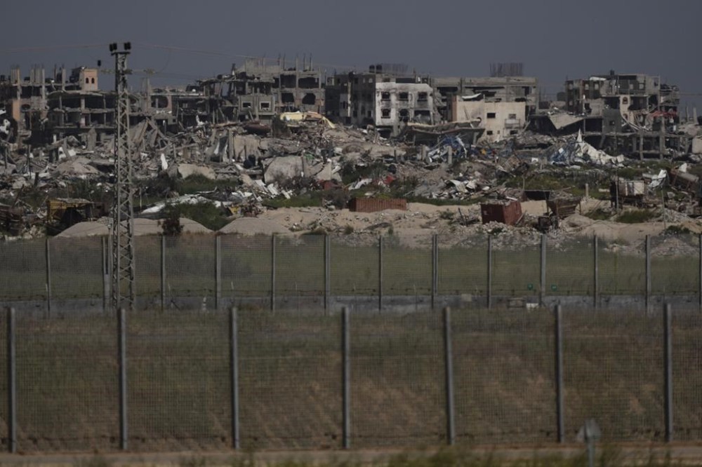 Destroyed buildings stand in the Gaza Strip as seen from southern Israel, Thursday, March 28, 2024. (AP Photo/Leo Correa)