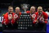 Canada skip Brad Gushue, from left to right, third Mark Nichols, second E.J. Harnden and lead Geoff Walker pose with the Brier Tankard and First Nations beadwork after defeating Saskatchewan in the final at the Brier, in Regina, Sunday, March 10, 2024. THE CANADIAN PRESS/Darryl Dyck