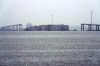 A container ship rests against the wreckage of the Francis Scott Key Bridge on Thursday, March 28, 2024, in Baltimore, Md. After days of searching through murky water for the workers missing after the bridge collapsed, officials are turning their attention Thursday to what promises to be a massive salvage operation. (AP Photo/Matt Rourke)