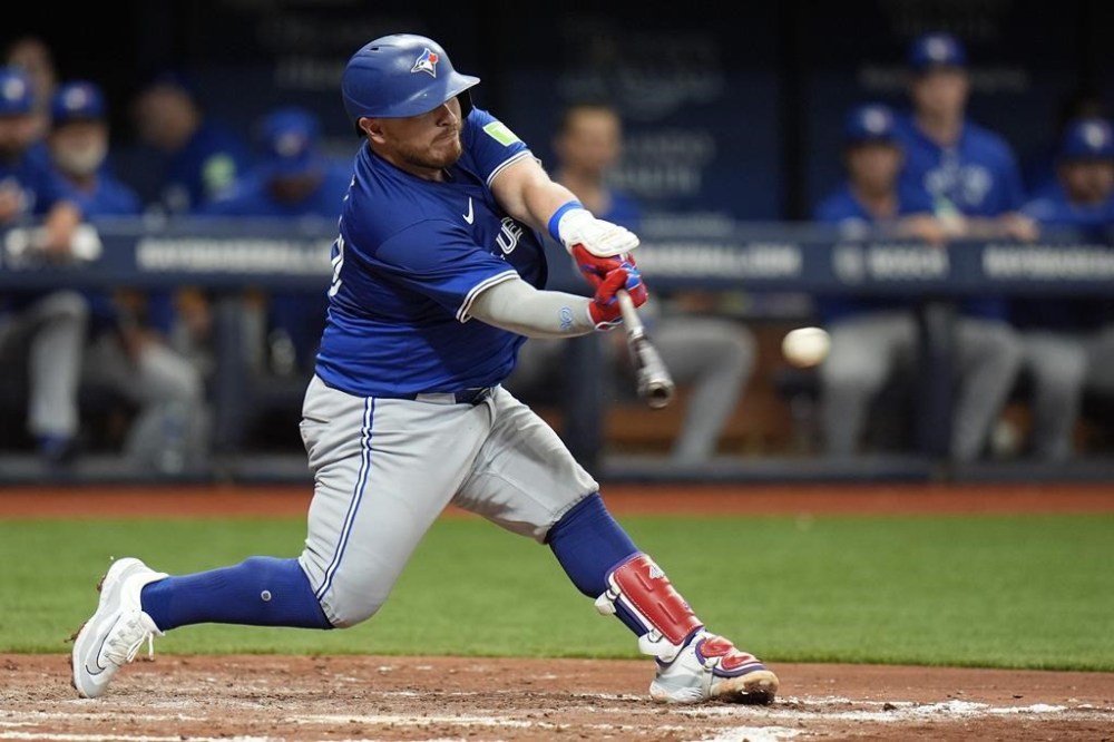 Toronto Blue Jays' Alejandro Kirk connects for a two-run single off Tampa Bay Rays starting pitcher Zach Eflin during the sixth inning of a baseball game Thursday, March 28, 2024, in St. Petersburg, Fla. (AP Photo/Chris O'Meara)