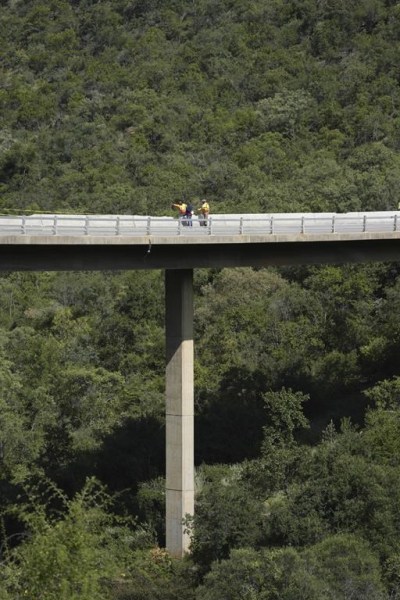 A view of a bridge a day after a bus plunged into a ravine on the Mmamatlakala mountain pass between Mokopane and Marken, around 300km (190 miles) north of Johannesburg, South Africa, Friday, March 29, 2024. A bus carrying worshippers on a long-distance trip from Botswana to an Easter weekend church gathering in South Africa plunged off a bridge on a mountain pass Thursday and burst into flames as it hit the rocky ground below, killing at least 45 people, authorities said. The only survivor was an 8-year-old child who was receiving medical attention for serious injuries. (AP Photo/Themba Hadebe)