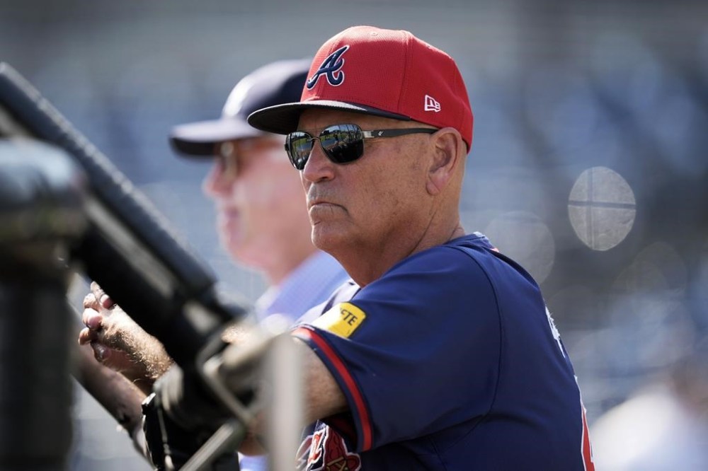 Atlanta Braves manager Brian Snitker watches batting practice before a spring training baseball game against the New York Yankees Sunday, March 10, 2024, in Tampa, Fla. (AP Photo/Charlie Neibergall)
