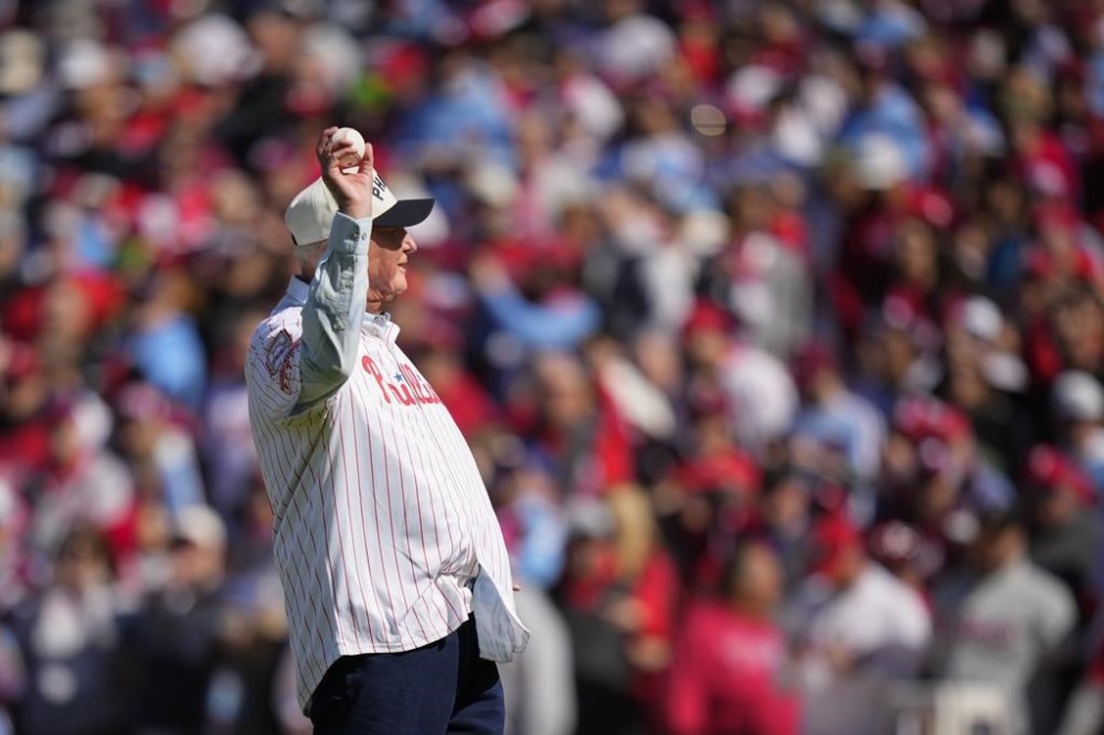 Former Philadelphia Phillies manager Charlie Manuel throws out a ceremonial first pitch ahead of an opening day baseball game between the Philadelphia Phillies and the Atlanta Braves, Friday, March 29, 2024, in Philadelphia. (AP Photo/Matt Slocum)