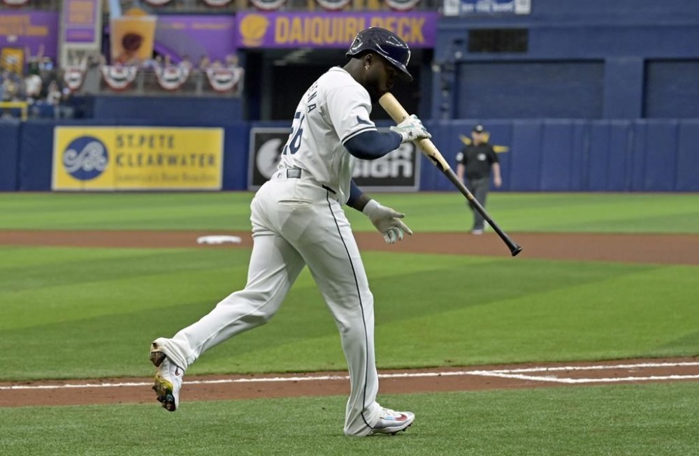 Tampa Bay Rays' Randy Arozarena kisses his bat after hitting a solo home run off Toronto Blue Jays starter Yusei Kikuchi during the fifth inning of a baseball game, Saturday, March 30, 2024, in St. Petersburg, Fla. (AP Photo/Steve Nesius)