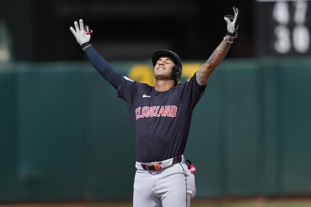 Cleveland Guardians' Brayan Rocchio gestures after hitting a double against the Oakland Athletics during the fourth inning of a baseball game in Oakland, Calif., Saturday, March 30, 2024. (AP Photo/Jeff Chiu)