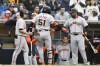 San Francisco Giants' Jung Hoo Lee (51) is congratulated after hitting a solo home run during the eighth inning of a baseball game against the San Diego Padres, Saturday, March 30, 2024, in San Diego. (AP Photo/Denis Poroy)